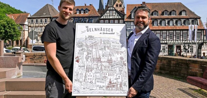 Bürgermeister Daniel Chr. Glöckner (rechts) und Sascha Reissmann, einer die Offenbacher Initiatoren der besonderen Städteporträt-Reihe, präsentieren den Kunstdruck „The Gelnhäuser“. 